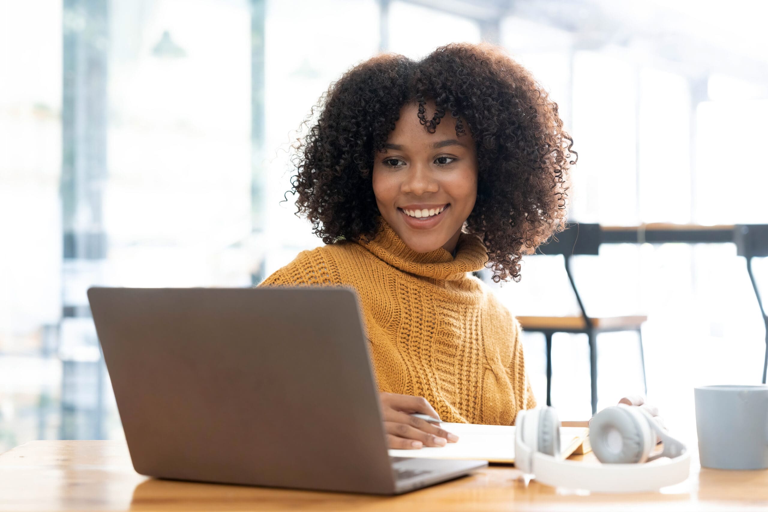 How Does the Abortion Pill Work? A woman searching on her laptop "How Does the Abortion Pill Work?"